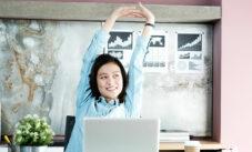 Office Woman Stretching Body For Relaxing While Working With Laptop Computer At Her Desk, Office Lifestyle, Business Situation