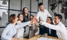 Group Of People Working Out Business Plan In An Office